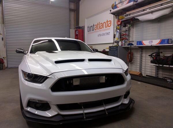 Ford Mustang GT front view showing professional dark window tint by Tint Waco