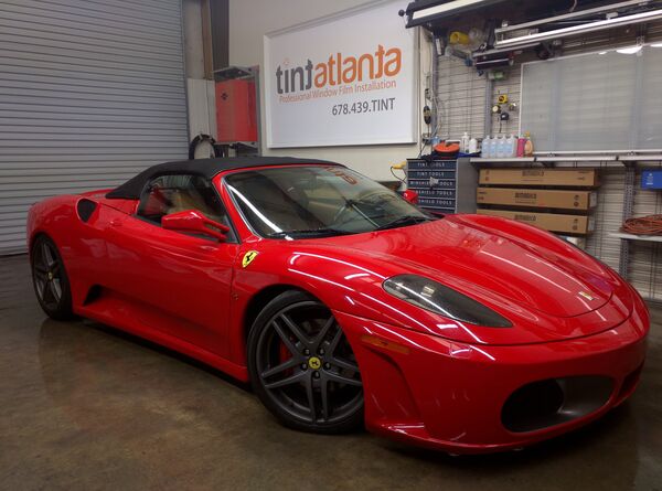 Red Ferrari F430 Spider convertible with premium window film at Tint Waco shop