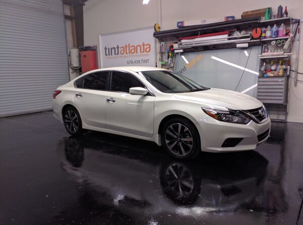 White Nissan Altima sedan with window tint installation Tint Waco